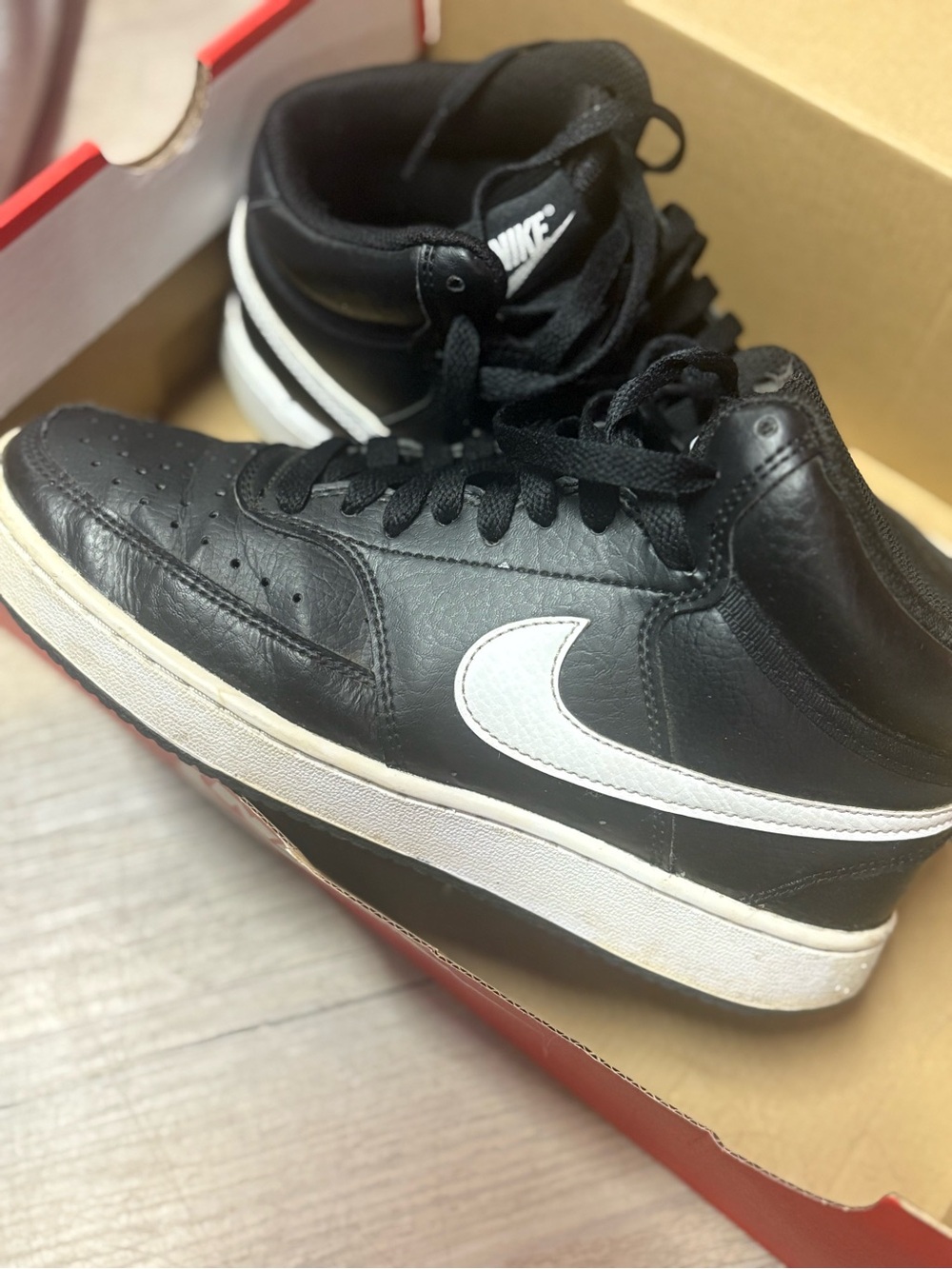 Nike Women’s Black and White High-Top Sneakers